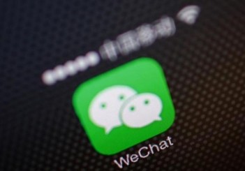 A picture illustration shows a WeChat app icon in Beijing