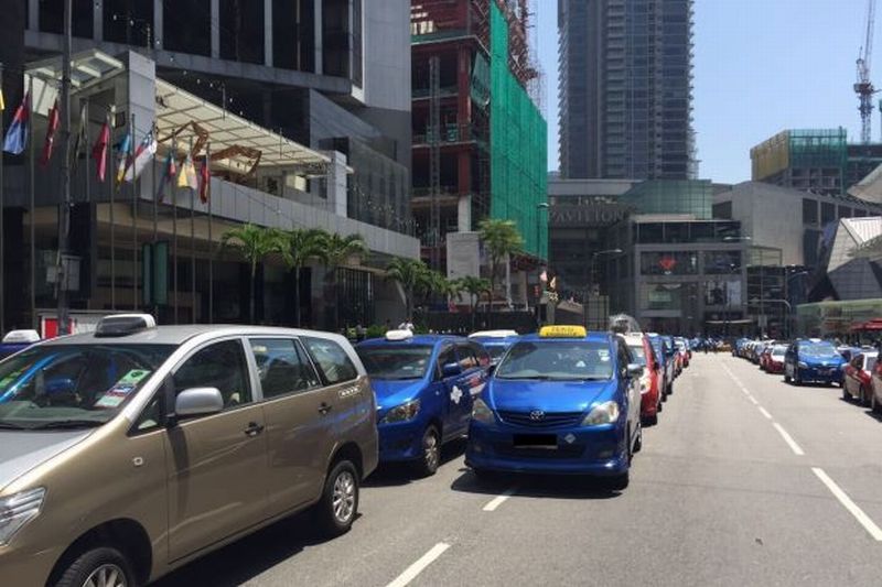 Taxi drivers protest over Uber and Grab brings KL traffic to a halt.