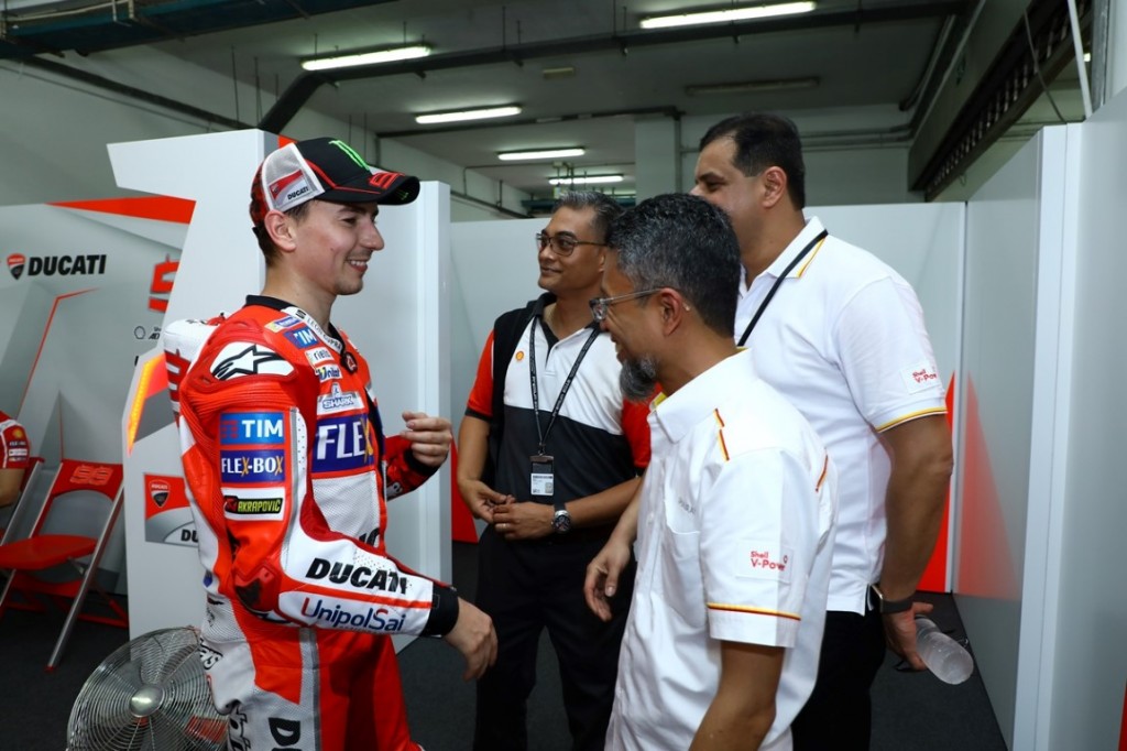 Ducati rider Jorge Lorenzo welcomes Shell Malaysia Trading Sdn Bhd managing director Shairan Huzani Husain.