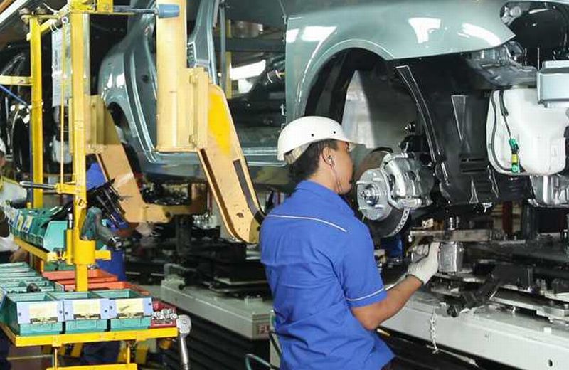 A Proton worker assembling a car at its Tanjung Malim plant.