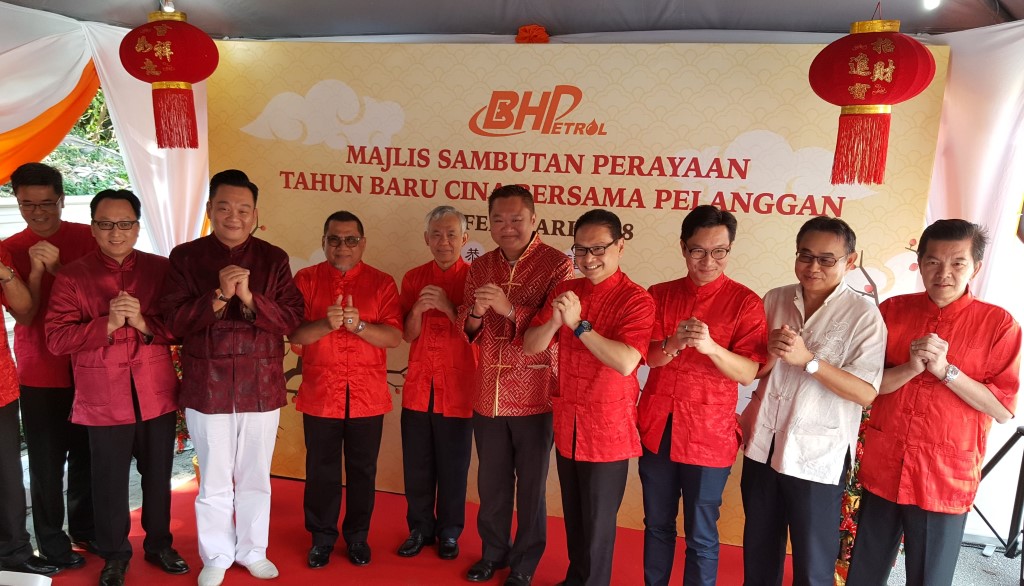 BHPetrol managing director Tan Kim Thiam (fifth from left), general manager (supply, retail, corporate affairs and government relations) Azizul Azily Ahmad (seventh from left) and retail senior marketing manager Baba Tan (eighth from left) with business associates and partners at a 2018 Chinese New Year customer appreciation event at BHPetrol Kuala Lumpur - Karak Highway service station in February.