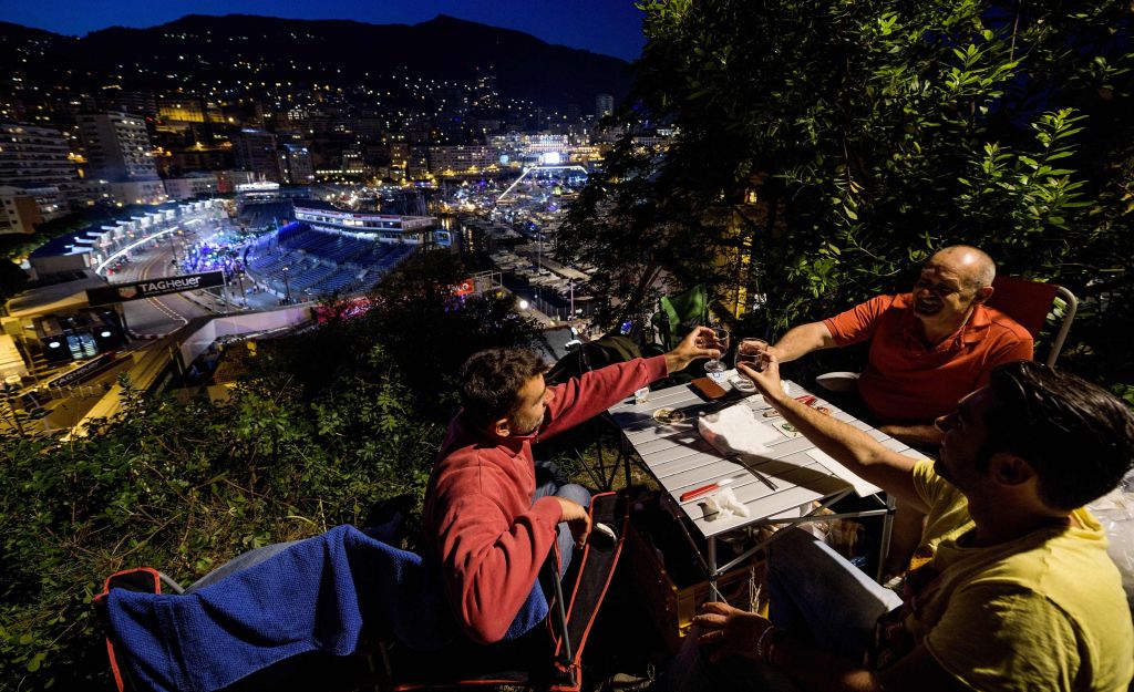 Dinerss drinking wine at The Rock hill overlooking a Monaco street. - AFP