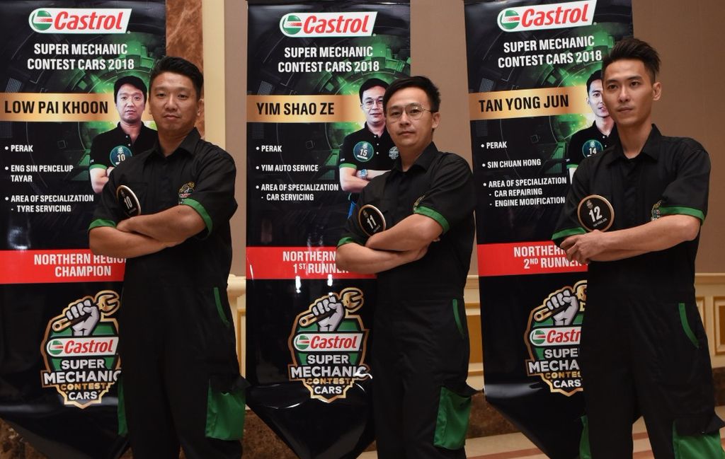 The Malaysian mechanics (from left) Low, Yim and Tan.