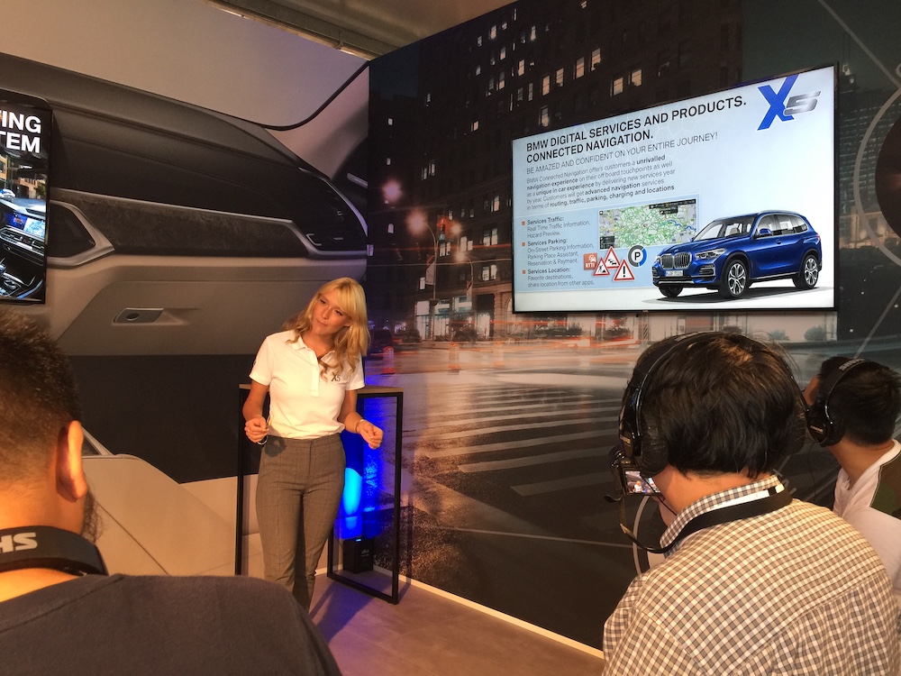 Connected Drive/Digital Services specialist Carolin Raabe explaining the relevant features in the new X5 to members of the media.