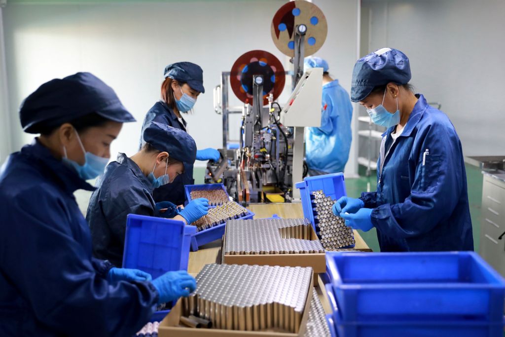 Employees working at a lithium battery factory in Huaibei, China's Anhui province. — AFP