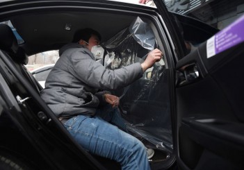 Plastic shields protect China's ride-hailing drivers against virus CHINA-HEALTH-VIRUS