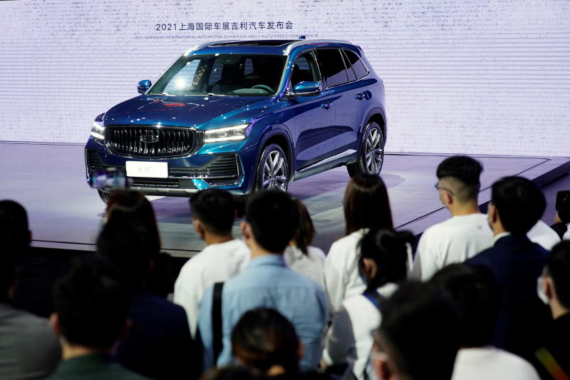 Visitors checking out the Xingyue L SUV at the Geely booth. - Reuters