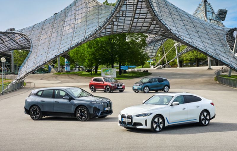 The new iX (left) and i4 pose in front together with the iX3 and BMW's electric pioneer i3 (rear right), which has been in the range since 2013.