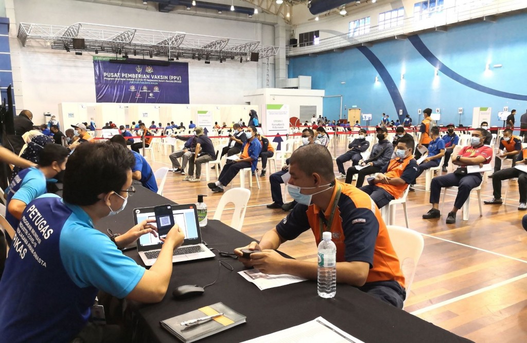 Proton staff at the Tanjung Malim plant registering for vaccination.