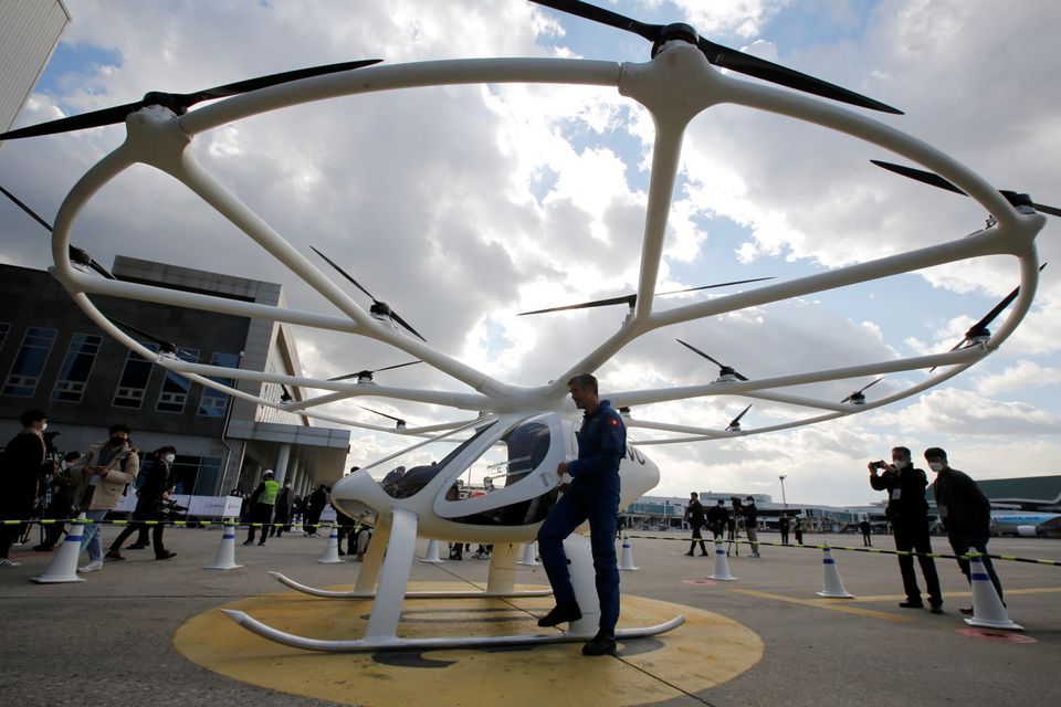 A pilot alighting from a Volocopter 2X drone taxi during an Urban Air Mobility Airport Demo event at Gimpo Airport in Seoul today. — Reuters
