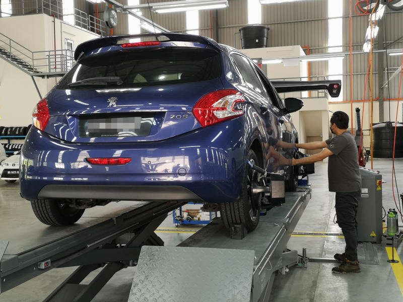 Wheel alignment in progress.