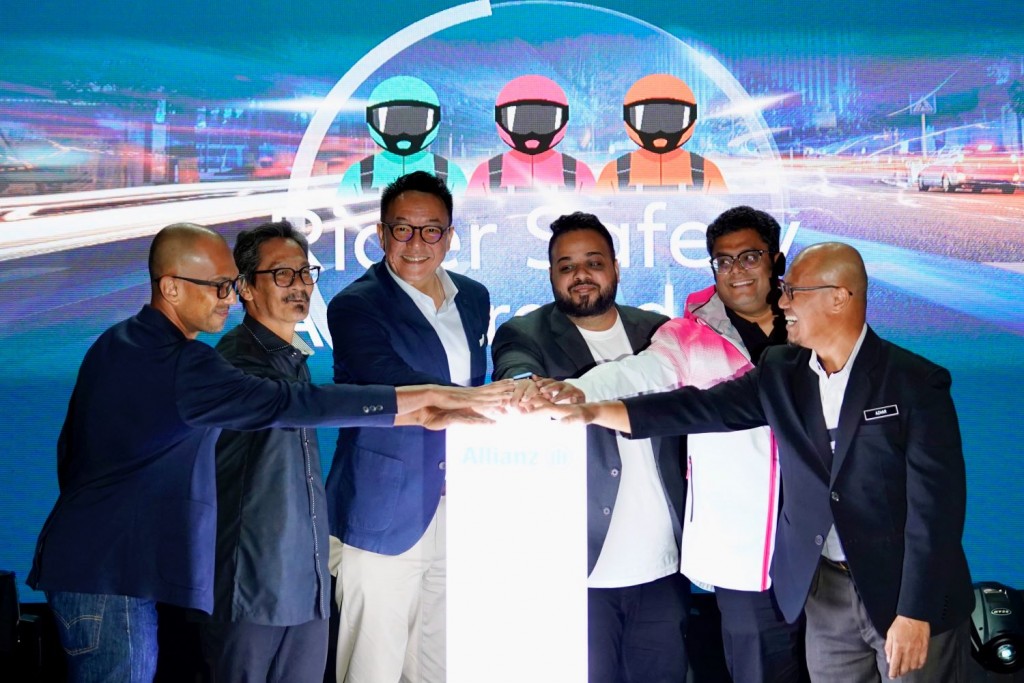 (From left) Grab Malaysia country operations and mobility director Rashid Shukor; Road Safety Expert Association founder Jamil Manan Supri; Wang; Lalamove Malaysia public affairs manager Abhishek Menon; foodpanda Malaysia operations director Shubham Saran and Azhar launching Allianz Malaysia’s safety training programmes for p-hailing companies and the community.